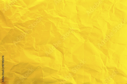 
Crumpled yellow paper as background photo