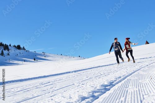 Couple having fun running down slope © FS-Stock