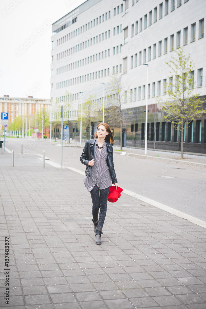 Young beautiful brunette girl walking in the city Young beautiful brunette girl walking in the city