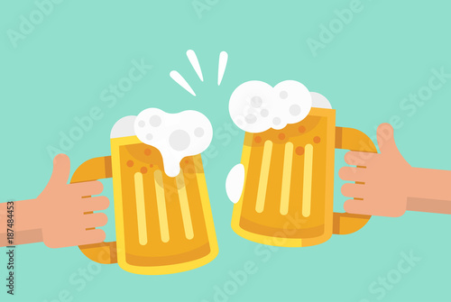 Two hands holding and clinking two beer mug.