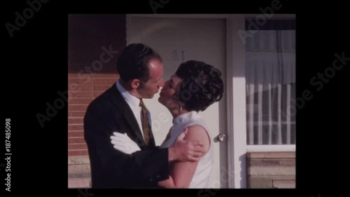 1969  Dressed up Couple kisses and poses for camera