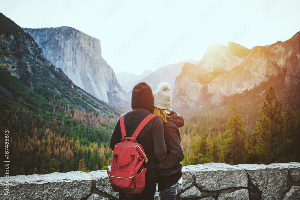 Loving couple enjoying famous Tunnel View in Yosemite National Park, California USA