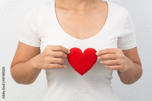 Fototapeta Naklejka Na Ścianę i Meble -  valentine day concept,close up hand woman holding a red heart