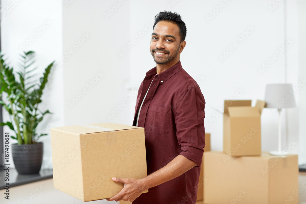 happy man with box moving to new home happy man with box moving to new home