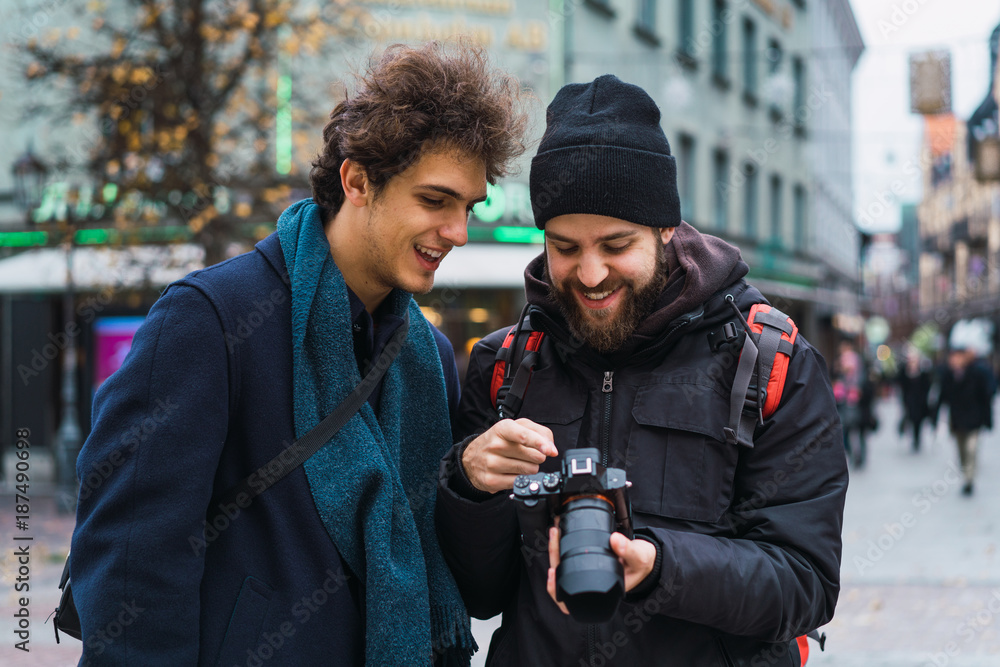 Cheerful men watching camera Cheerful men watching camera