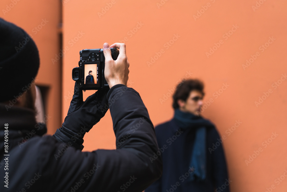 Photographer taking shots of man Stock Photo Adobe Stock