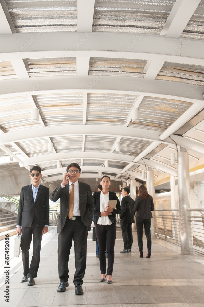 Asian Business teams competitors are walking away after not complete with their project.