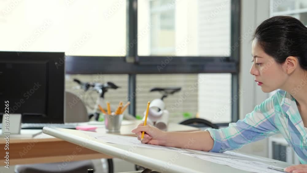 beautiful female designer in office working beautiful female designer in office working