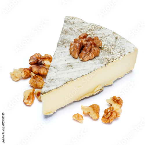 traditional french brie cheese on a white background