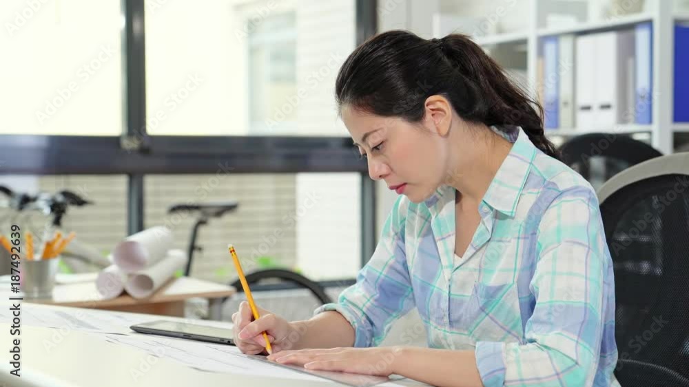 female Asian architect with digital tablet female Asian architect with digital tablet