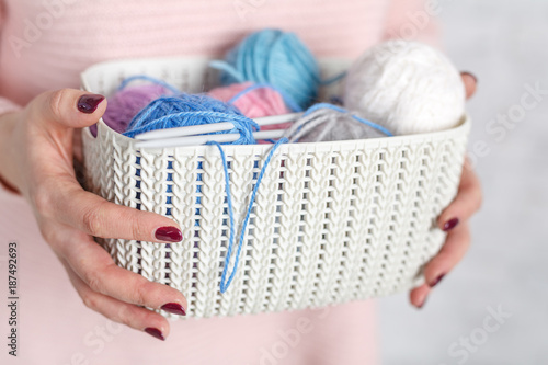 Knitting concept< female hands with color clew ball