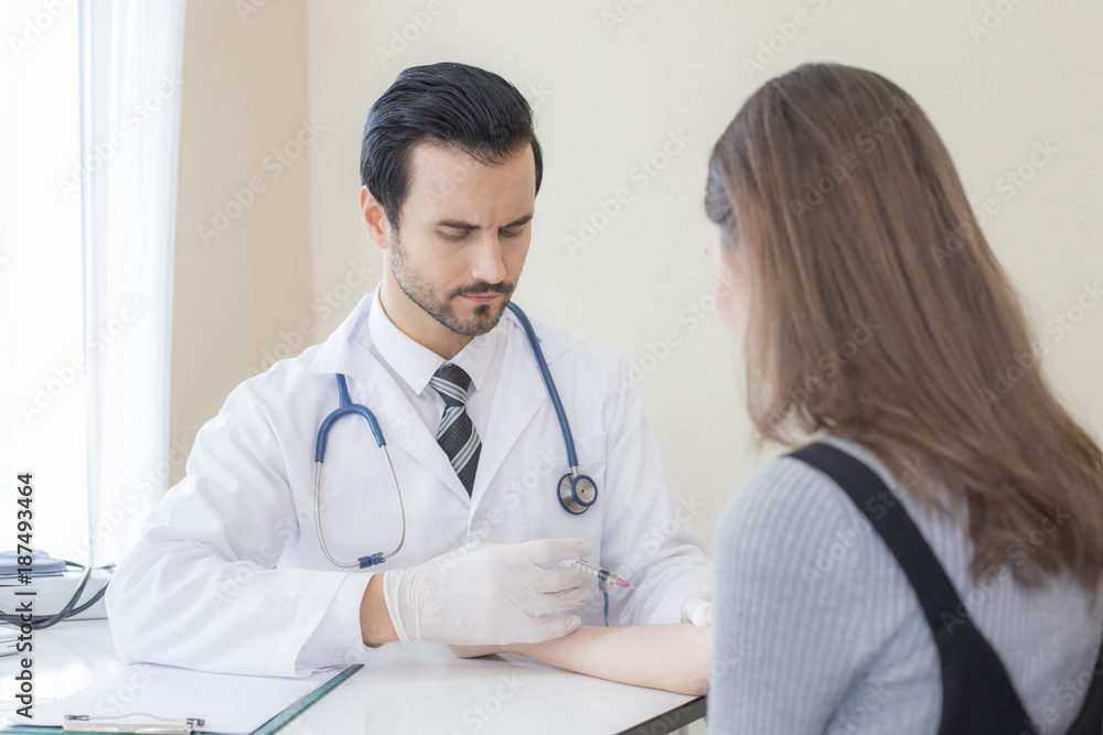 Doctor inject woman at hospital. People with medical concept. Doctor inject woman at hospital. People with medical concept.