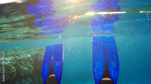 Blue Fins on the man's feet