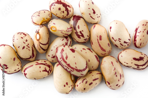 Raw pinto beans isolated on white background