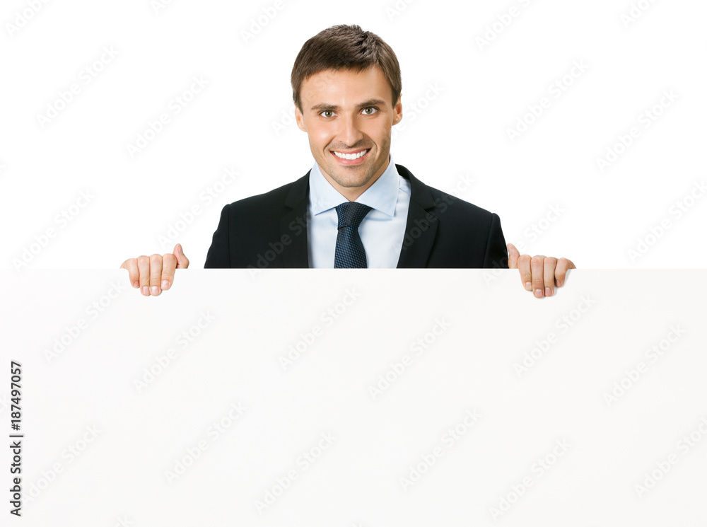 Happy businessman showing signboard, isolated Happy businessman showing signboard, isolated