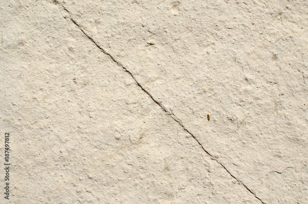 Natural color stone with a diagonal crack suitable for a background Natural color stone with a diagonal crack suitable for a background