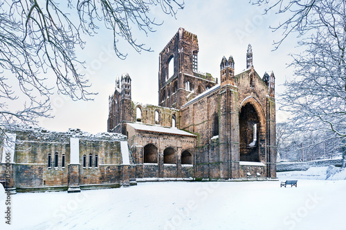 Kirkstall Abbey in snowy morning, Leeds, Yorkshire, England, UK photo
