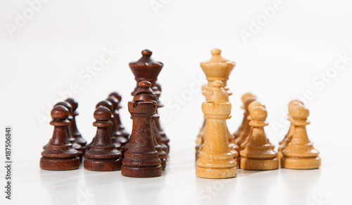 Business concept - chess - white team against black team - competition