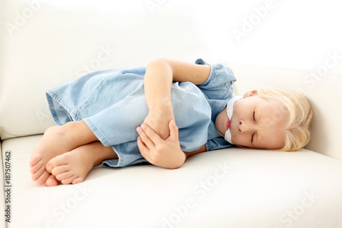 Photography Helpless little girl lying with gag in mouth. Child abuse concept