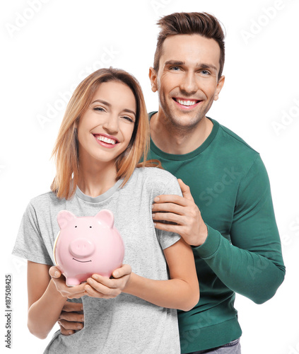Young couple with piggy ban...