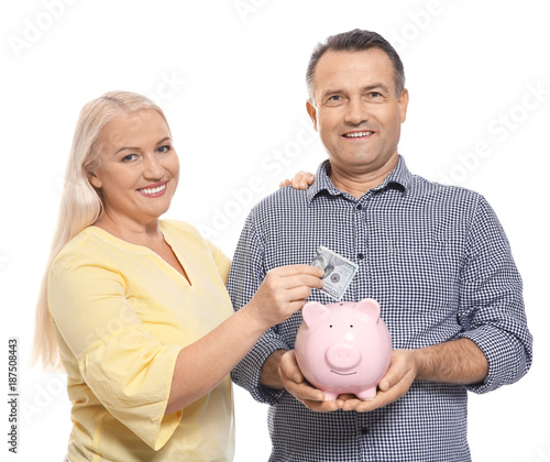 Mature couple with piggy ba...