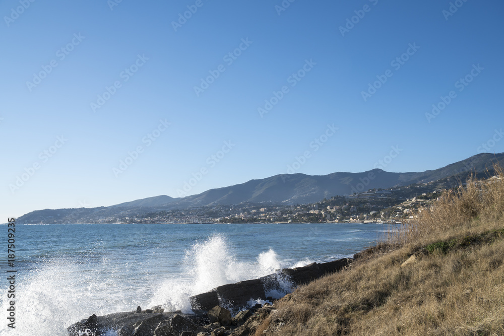 View of the Italian coast with the city of Sanremo in the background. This town is famous for the cultivation of flowers and the annual Italian song festival.