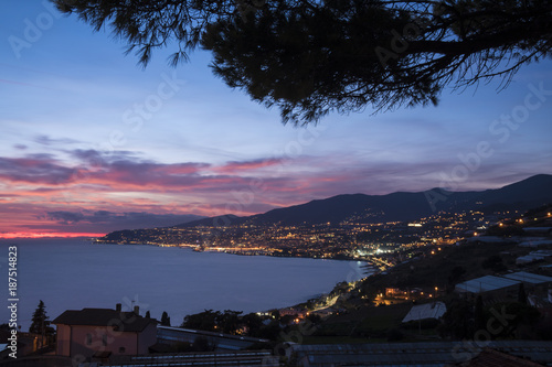 Night panorama of the Italian coast with the city of Sanremo in the background.