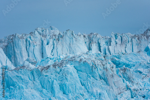 Wall of the claving Eqi glacier, Greenland photo