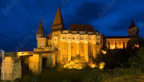 Illuminated Corvin Castle in night, Romania