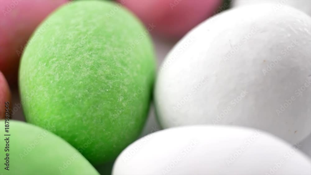 Heap of colorful chocolate balls candies in sugar glaze isolated on white background. Multicolored candy peanuts Heap of colorful chocolate balls candies in sugar glaze isolated on white background. Multicolored candy peanuts