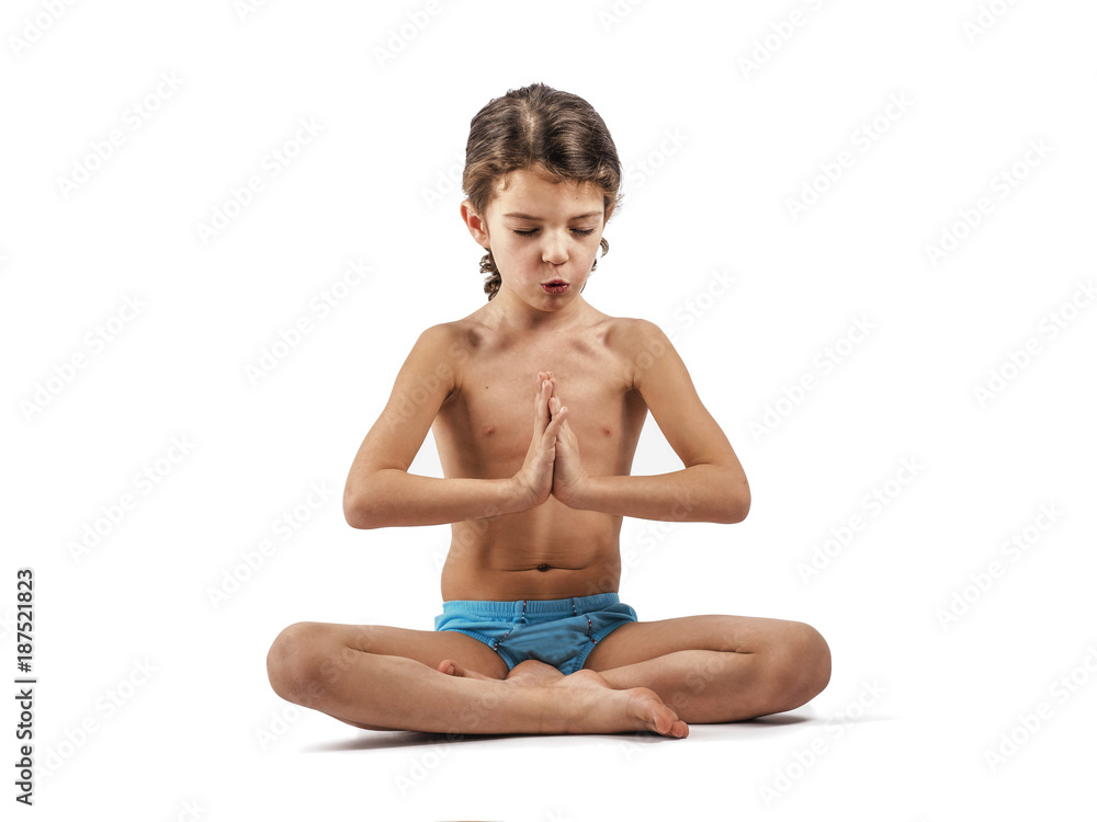 Cute boy in swimming trunks doing gymnastic exercises. Cute boy in swimming trunks doing gymnastic exercises.