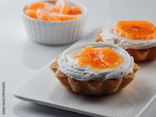 tartlets with cream and tangerines