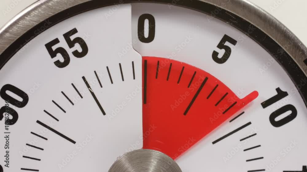 A time lapse of a dial kitchen timer counting down for 10 seconds to zero. A time lapse of a dial kitchen timer counting down for 10 seconds to zero.