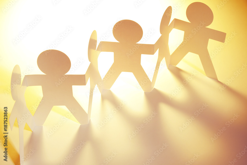 Paper chain team holding hands Paper chain team holding hands