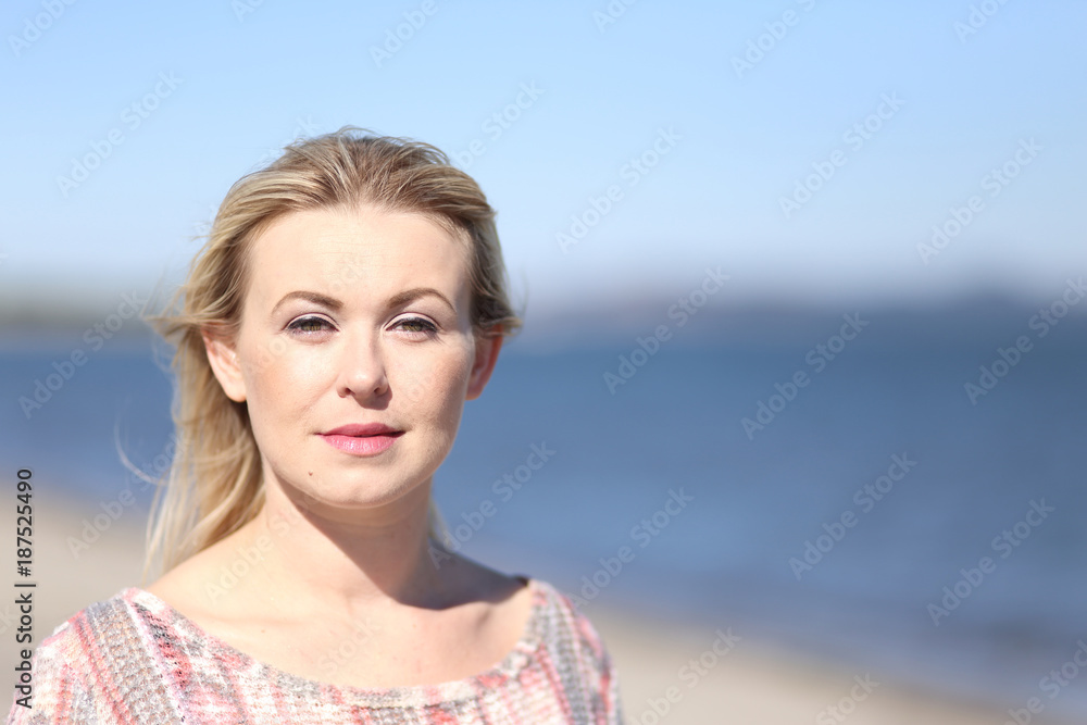 Portrait of a young woman at the beach.