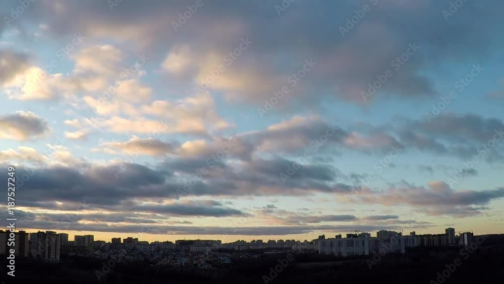 Time lapse evening clouds over city, beginning of sunset and night Time lapse evening clouds over city, beginning of sunset and night