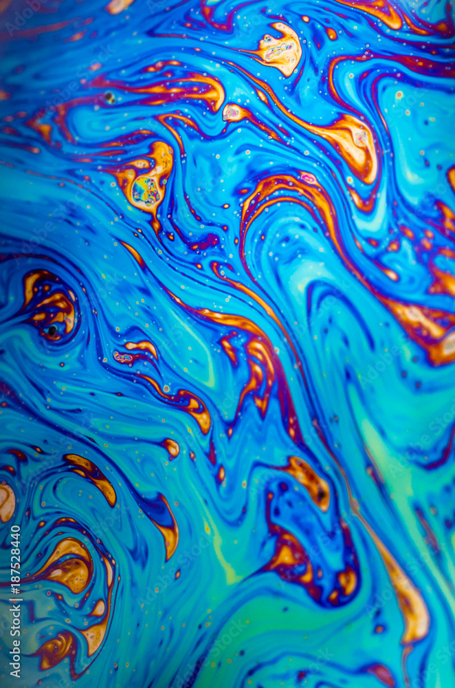 Beautiful psychedelic abstraction formed by light on the surface of a soap bubble Beautiful psychedelic abstraction formed by light on the surface of a soap bubble