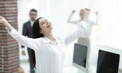 happy young business woman on a blurred office background. Free Download happy young business woman on a blurred office background. - GFXLoad