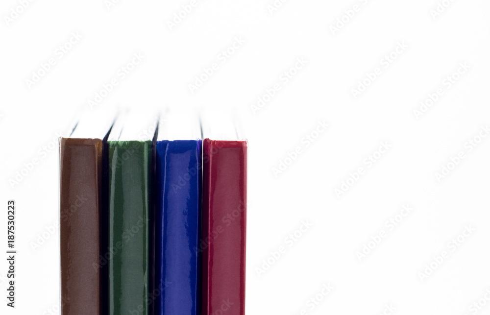 Four books close-up on a white background