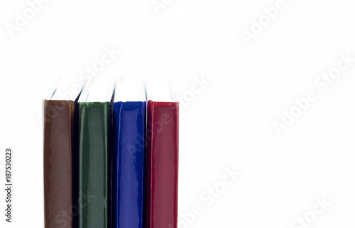 Four books close-up on a white background