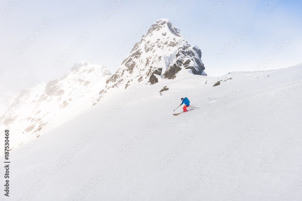 Man skiing off piste outdoor in beautiful mountain environment Man skiing off piste outdoor in beautiful mountain environment