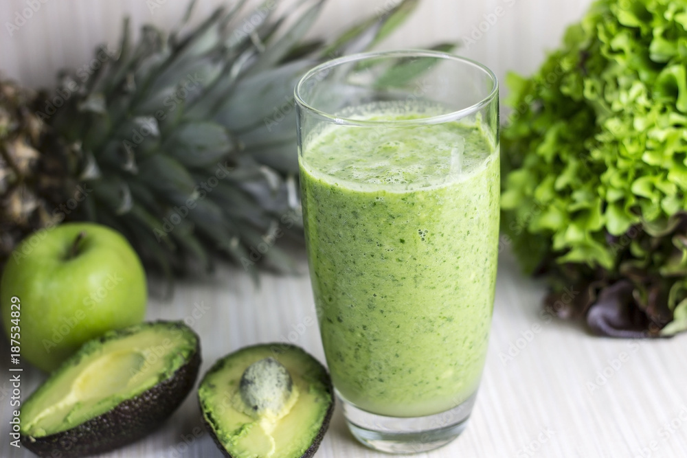 Fresh green smoothie with avocado, spinach, parsley, wild rocket and lemon. Detoxication juice.