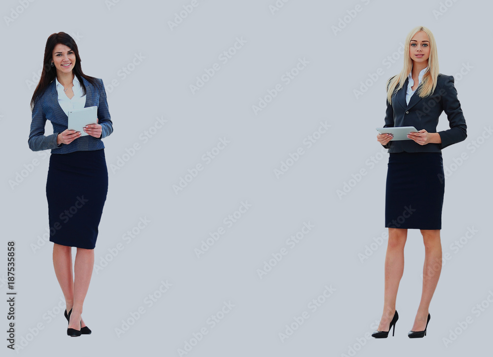 Two businesswomen showing an empty board,lots of copyspace. Two businesswomen showing an empty board,lots of copyspace.