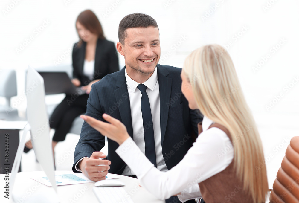Manager talking with a colleague at the workplace Manager talking with a colleague at the workplace