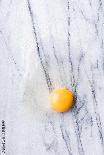 Raw egg on marble background. photo