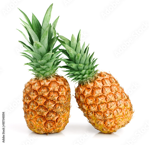 Two ripe pineapple isolated on white background