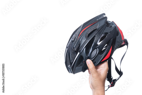 Hand holding bicycle safety helmet for mountain bike or all purpose rider