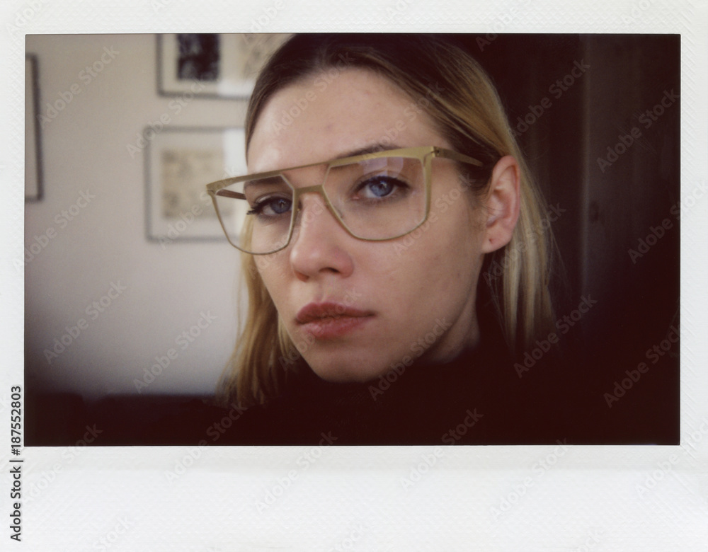Selfie: Woman in glasses looking at camera. Selfie: Woman in glasses looking at camera.