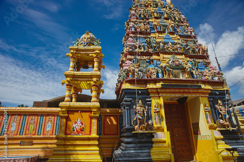 Hindu temple opposite cloudy sky in Sri Lanka photo