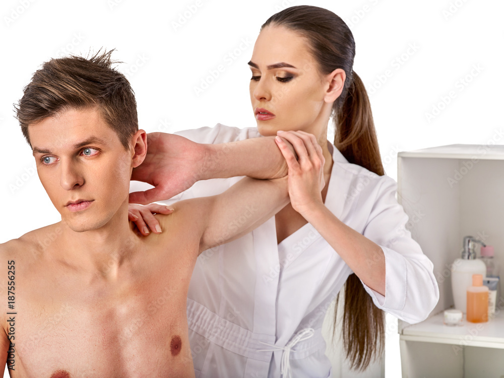 Shoulder and neck massage for woman in spa salon. Doctor making neck therapy in rehabilitation center. Direction of dislocation in the clinic. Best clinics in Europe. Shoulder and neck massage for woman in spa salon. Doctor making neck therapy in rehabilitation center. Direction of dislocation in the clinic. Best clinics in Europe.